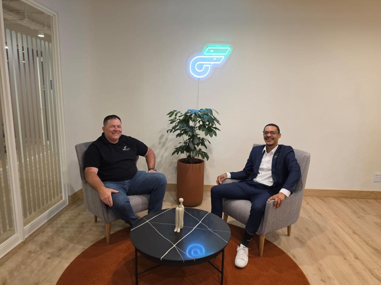 Oujan Brand with a client at the CtrlFleet offices